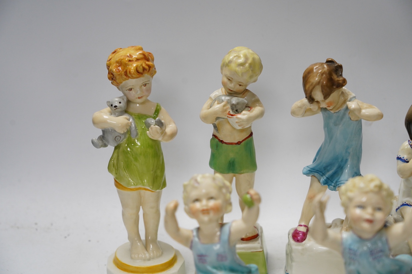 Nine Worcester F G Doughty 'days of week' figures, 3262, 3259, 3259, 3258 & 3261, largest 21cm high. Condition - good